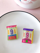 Colourful acrylic pins inspired by old school calendars - National Day