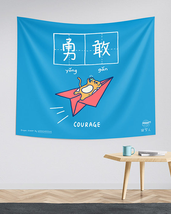 Blue tapestry for home decor with paper plane and cat design and motivational quote courage