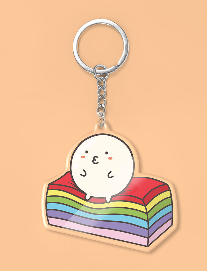Cute fishball character sitting on kueh lapis as a keychain