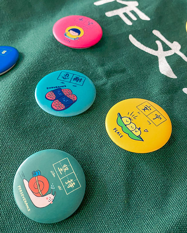 Dream chaser motivational button badges to pin on bags.