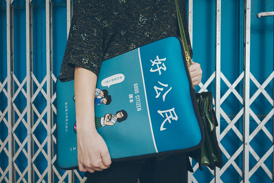 One-of-a-kind laptop sleeve with nostalgic Good Citizen textbook design