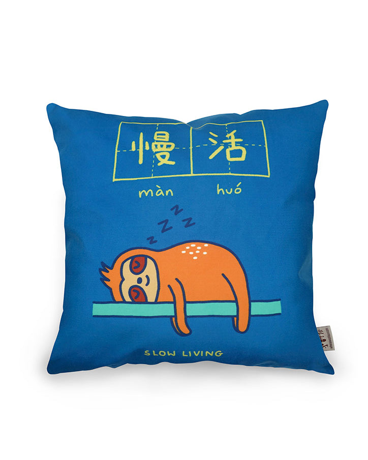 Dream chaser 'slow living' cushion cover with sloth illustration.