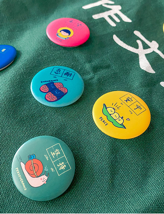 Dream chaser motivational button badges to pin on bags.