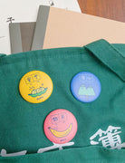 Dream chaser motivational button badges to pin on bags.