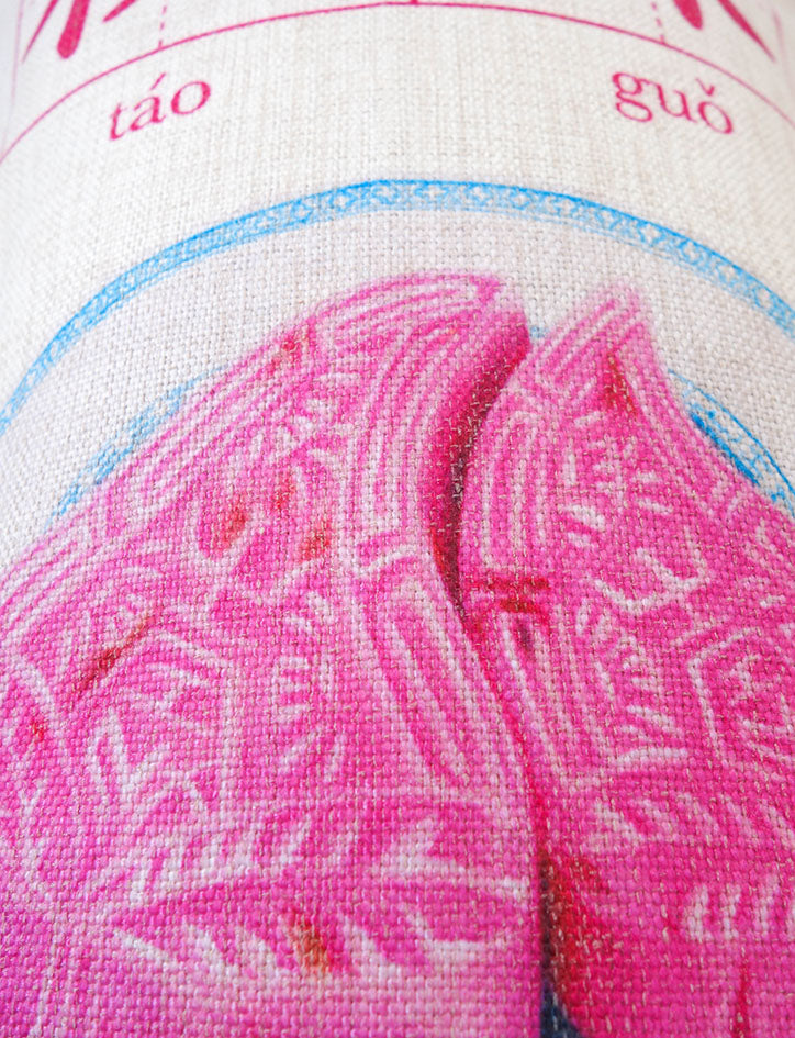 Up-close details of teochew peach-shaped kueh cushion cover.