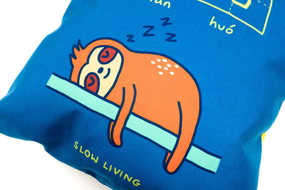 Dream chaser 'slow living' cushion cover with sloth illustration.